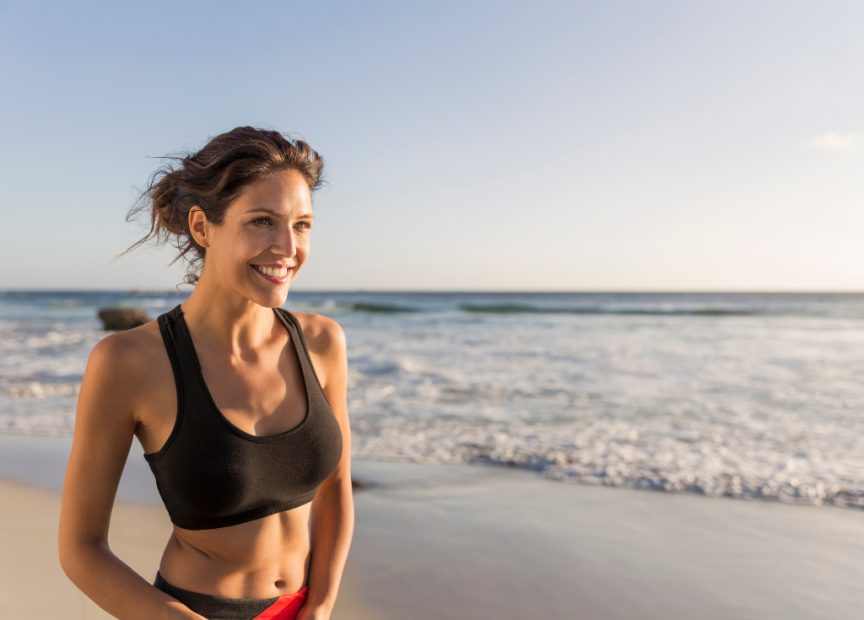 Happy Woman Smiling on Beach