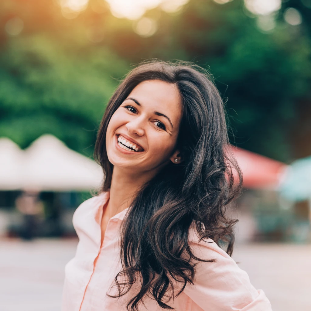 smiling woman with long brown hair