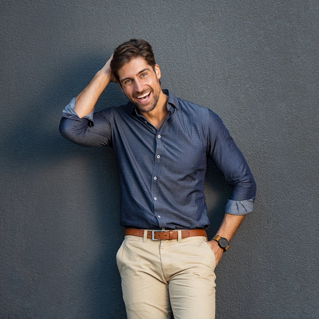 A male leaning against a wall