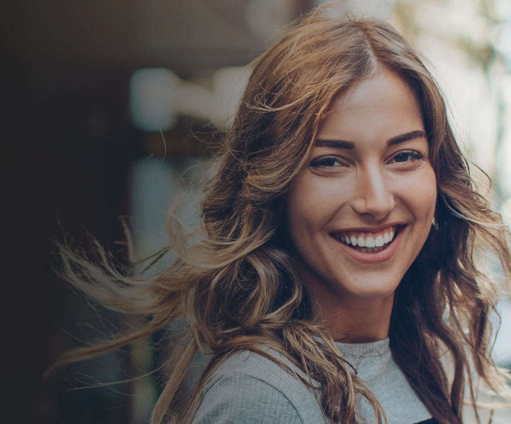 smiling woman with long brown hair