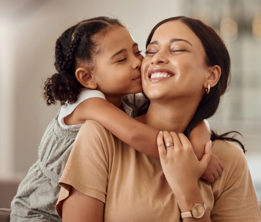 daughter hugging mother
