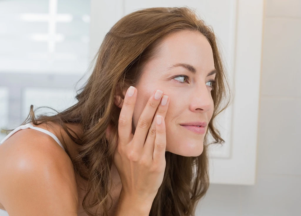 Woman checking skin