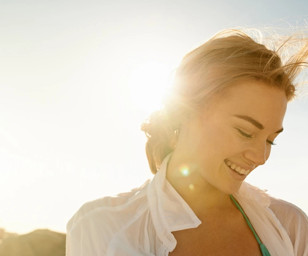 Woman backlit in sunshine